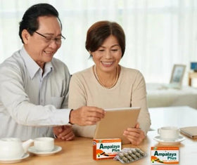 Ampalaya Plus 550mg capsules with a measuring spoon