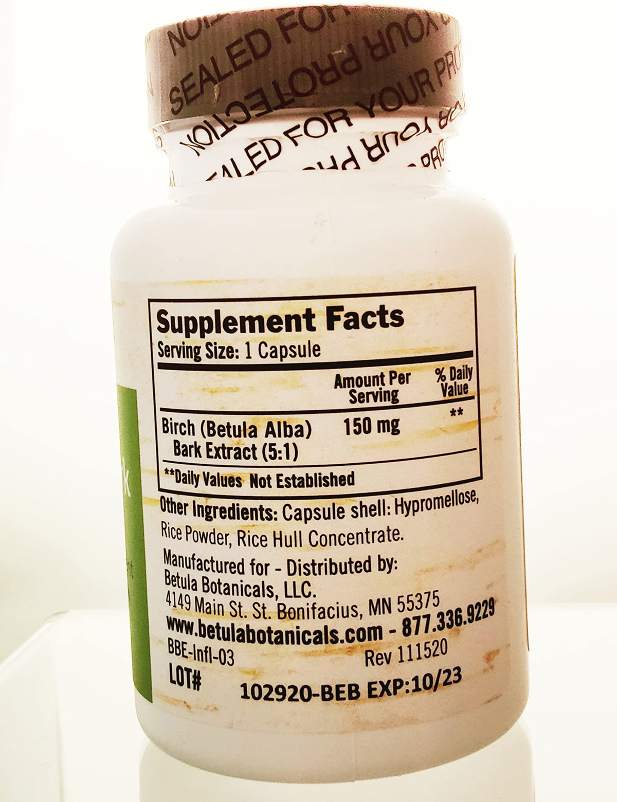 Betula Botanicals Birch Bark Extract capsules on a wooden table