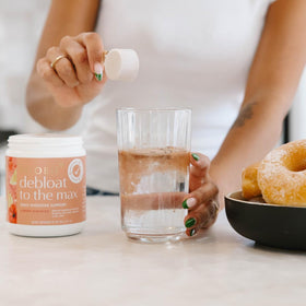 Boobie Brands Debloat to the Max powder in a kitchen setting