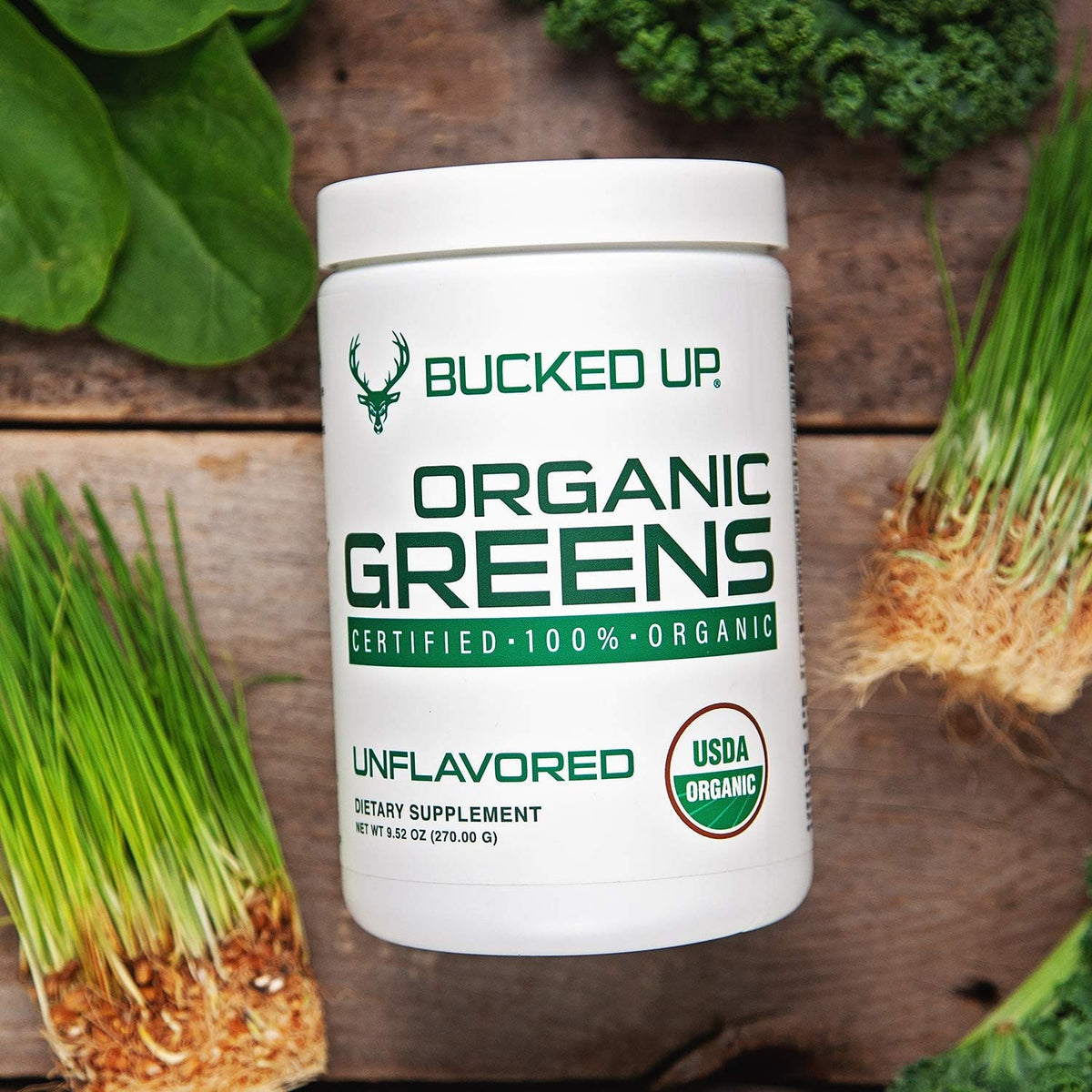 Bucked Up Greens Superfood Powder Unflavored in a glass of water