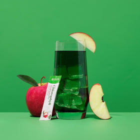 Close-up of Nature's Sunshine Chlorophyll Stick Pack with apple slices