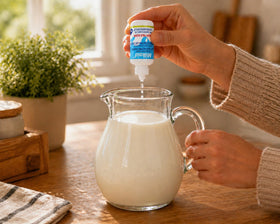 Milkaid Junior Lactase Enzyme Chewable Tablets in a child's hand