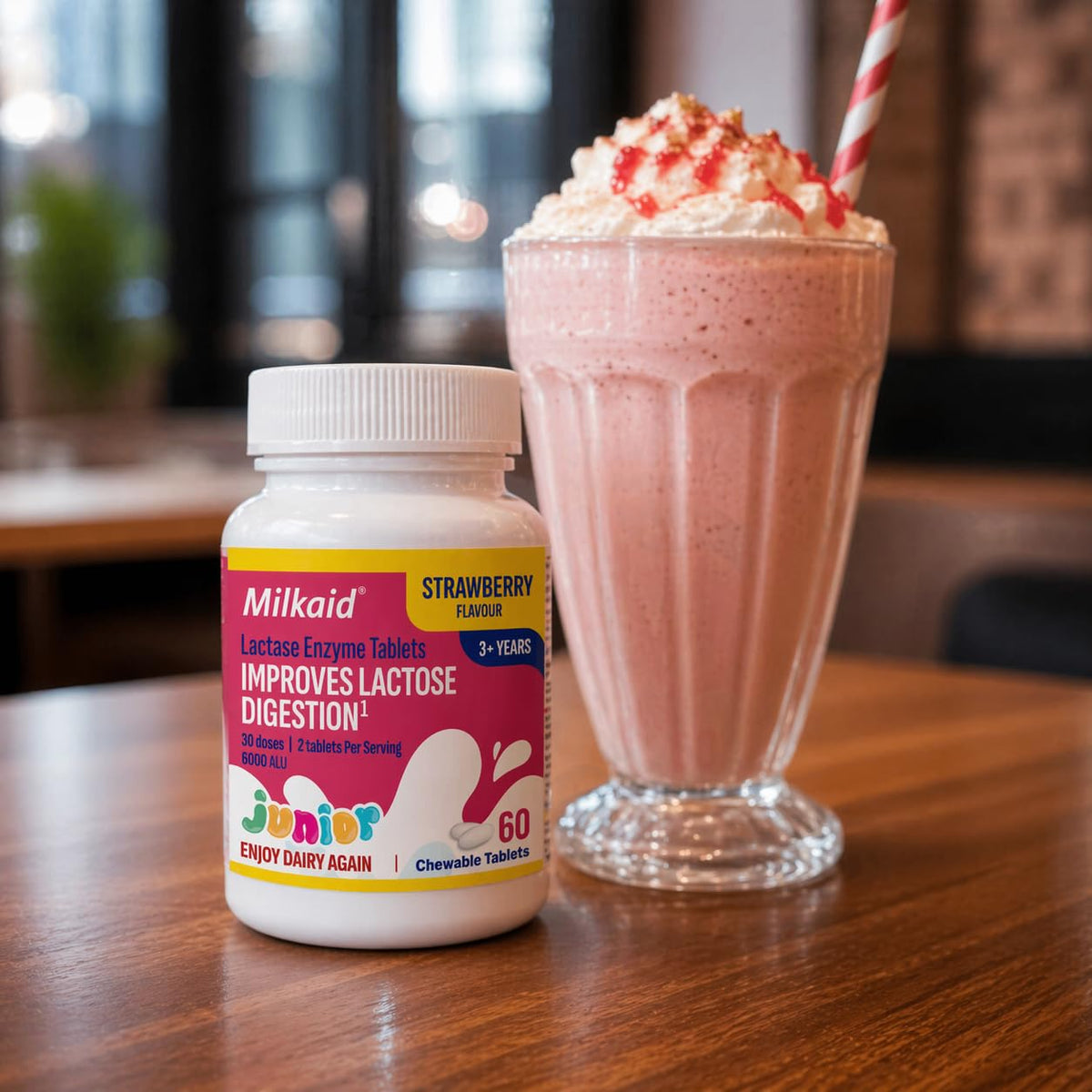 Milkaid Junior Lactase Enzyme Chewable Tablets with a glass of water
