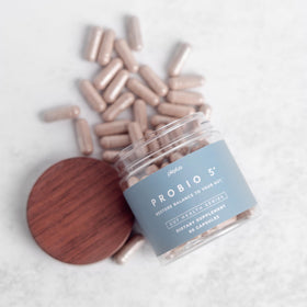 Plexus ProBio 5 capsules with a measuring spoon