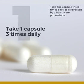 Premier Research Labs Calcium Magnesium Plus capsules on a wooden surface