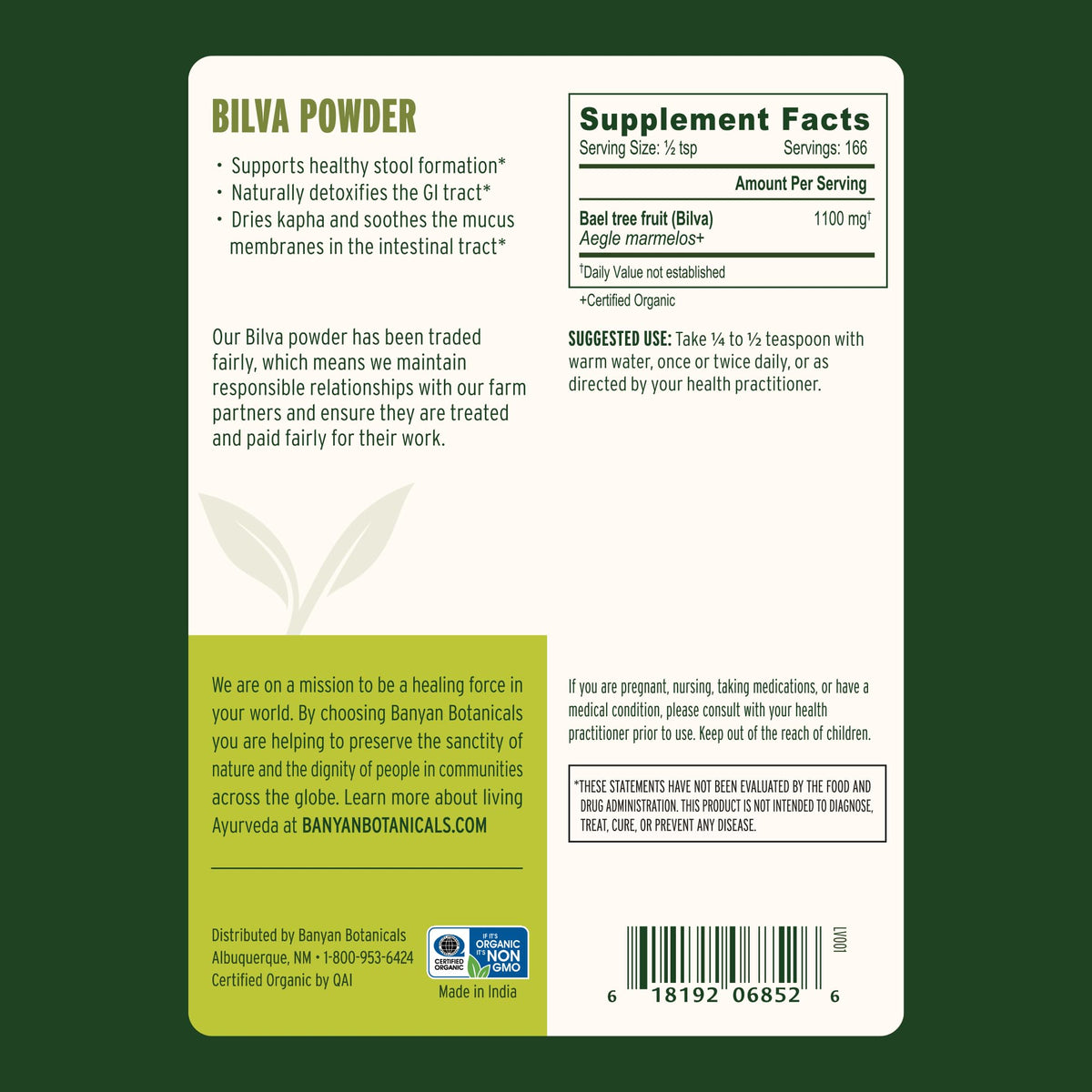 Spoonful of Banyan Botanicals Organic Bilva Powder on a wooden table
