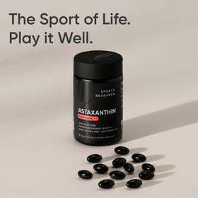 Sports Research Vegan Astaxanthin 12mg capsules in hand