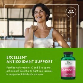 Swanson Cranberry 20:1 Juice Concentrate softgels with a measuring spoon